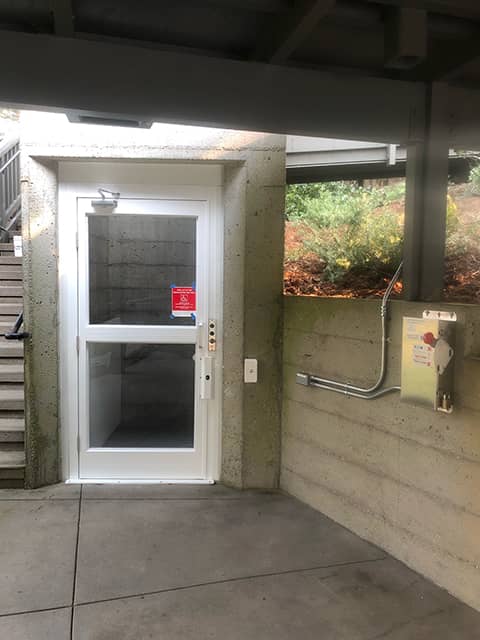 Outdoor Enclosed Wheelchair Lift - Bottom Door Closed