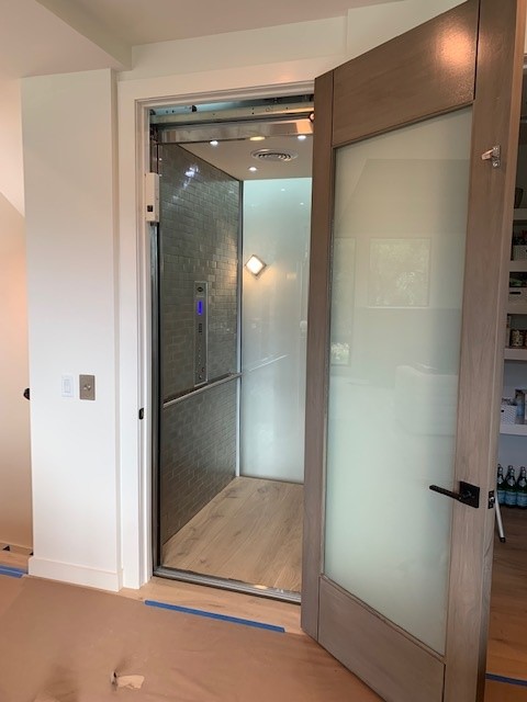Glass Elevator with frosted finishes interior view